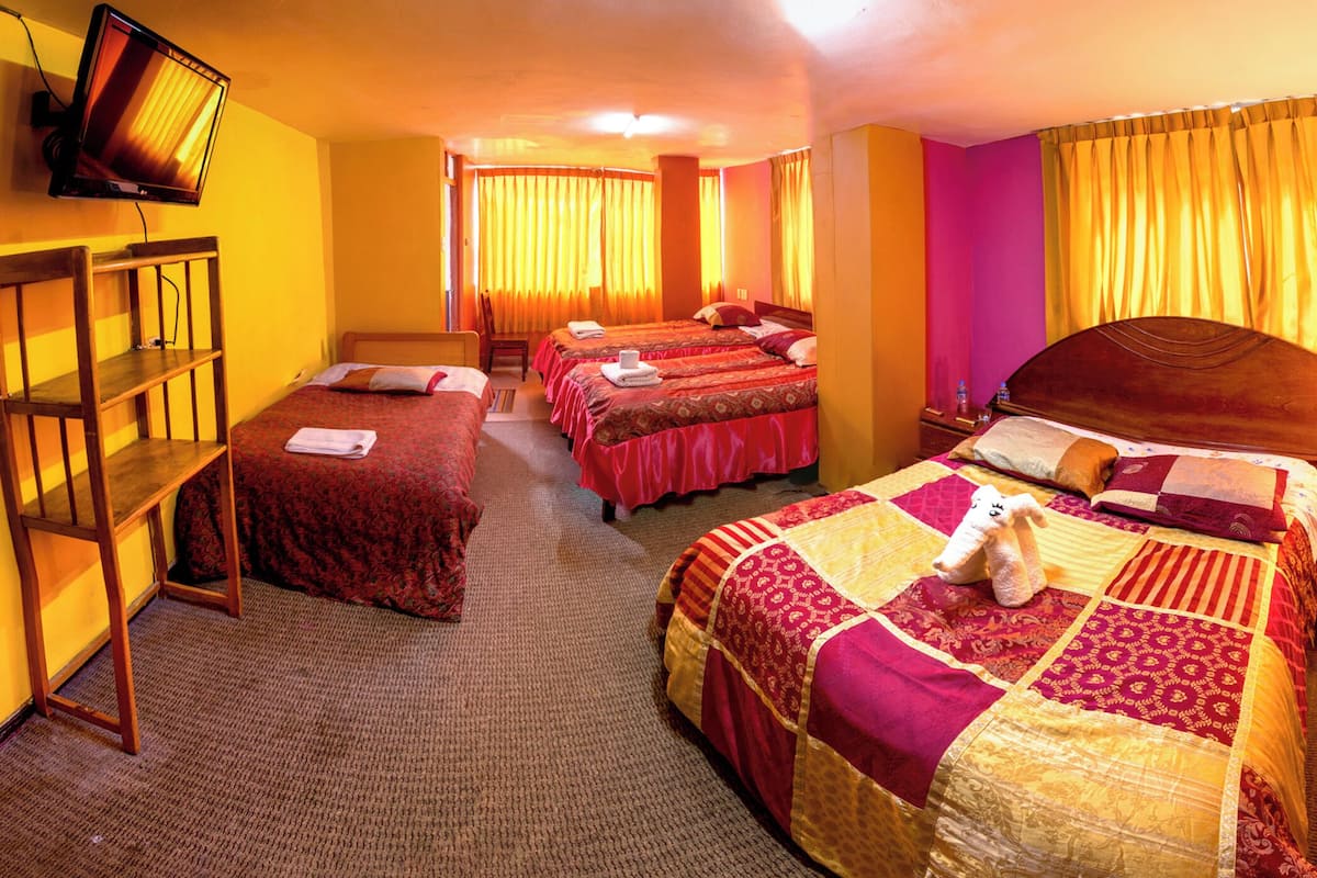 Classic Quadruple Room, City View | Desk, free WiFi, bed sheets