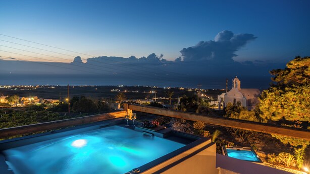 A rooftop pool with a view of the sea and a church in the distance. - Prive by Noelia Suites | Sunset View |Hot Tub-2Pax (Finikia)