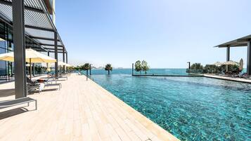 2 outdoor pools, pool umbrellas, pool loungers