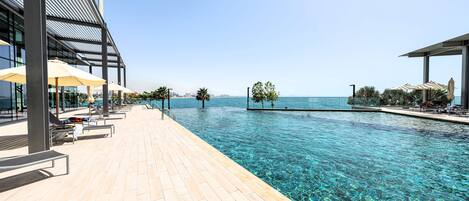 2 outdoor pools, pool umbrellas, pool loungers