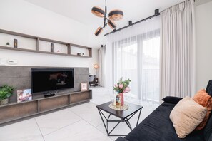 Apartamento, 1 quarto, sacada | Sala de estar