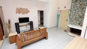 Family Villa, Balcony, Pool View | Living area | Flat-screen TV