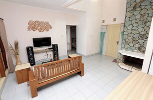 Family Villa, Balcony, Pool View | Living area | Flat-screen TV