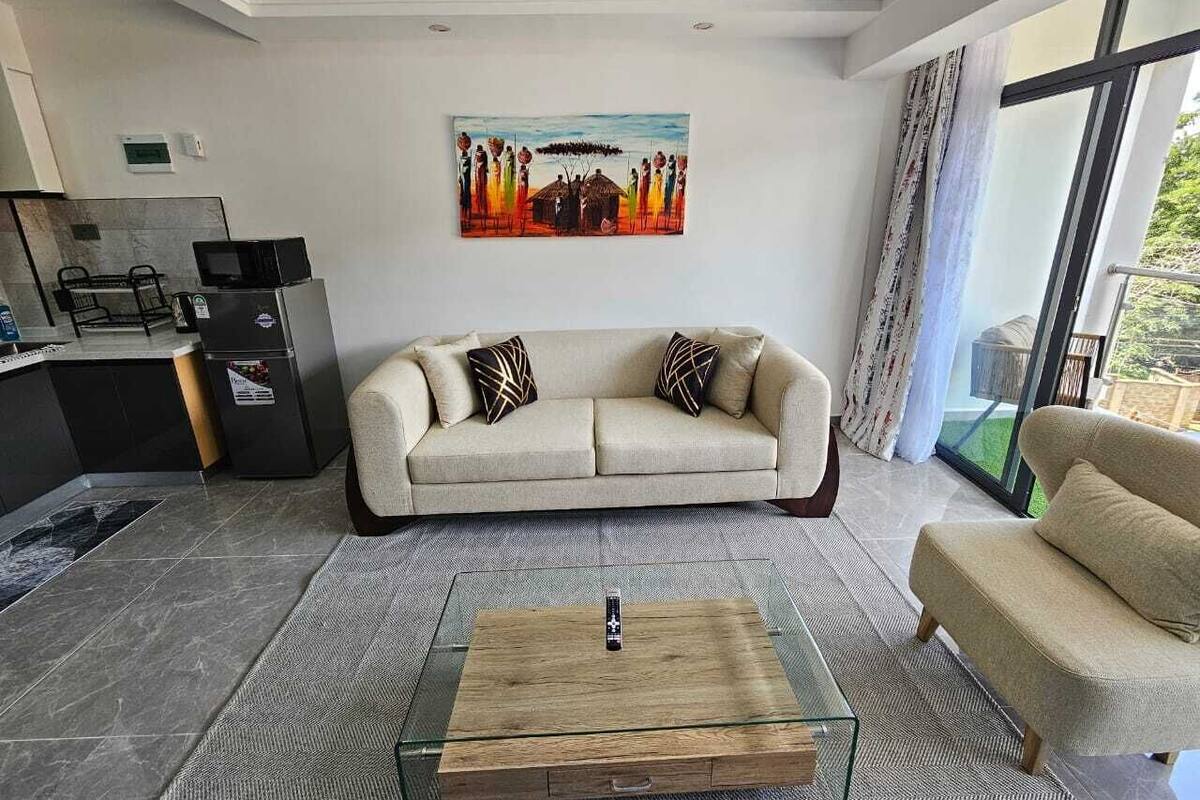 Elite Apartment | Living area | 64-inch Smart TV with digital channels