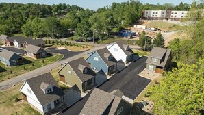 A residential area with multiple houses, a road, and a construction site in the background. - 5 Minutes From Dollywood/In DwTn Pigeon Forge (Pigeon Forge)