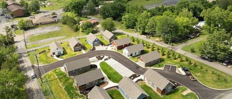 A residential area with houses, roads, and a large building.