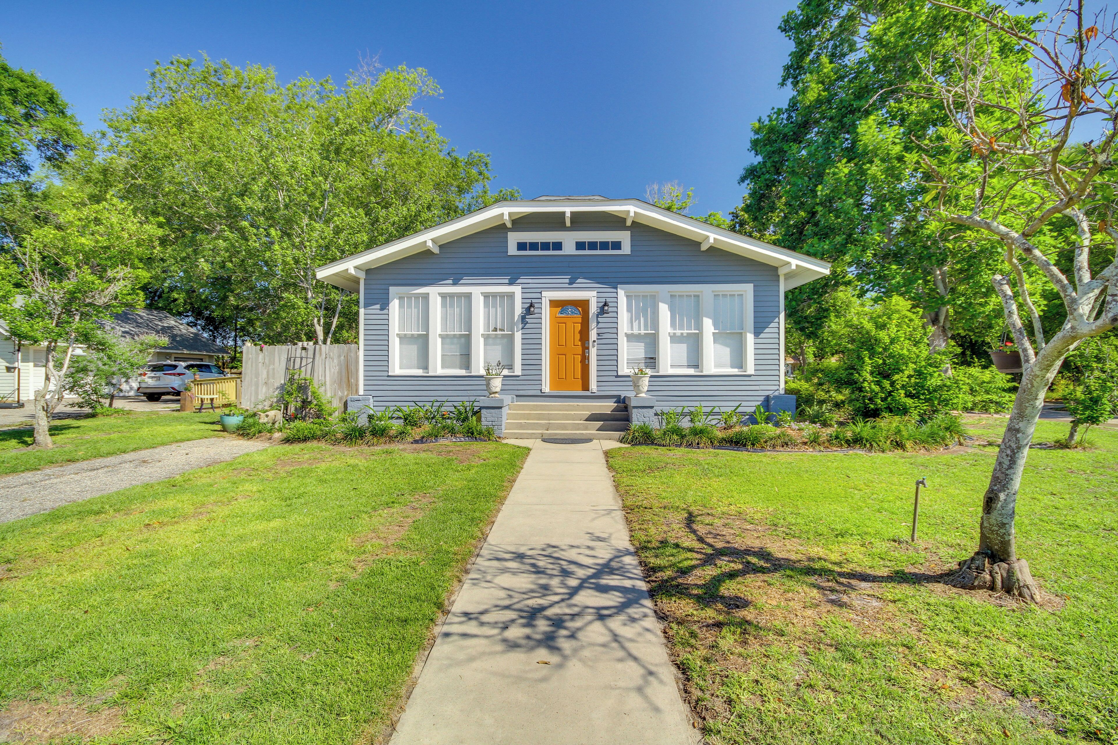 A single-story house with a front porch, a visible front door, and a clear pathway leading to the entrance.