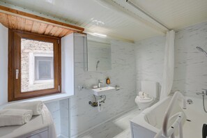 Family Apartment, 1 Bedroom (Rustic mountain Brissago 1) | Bathroom | Combined shower/bathtub, hair dryer, towels, soap