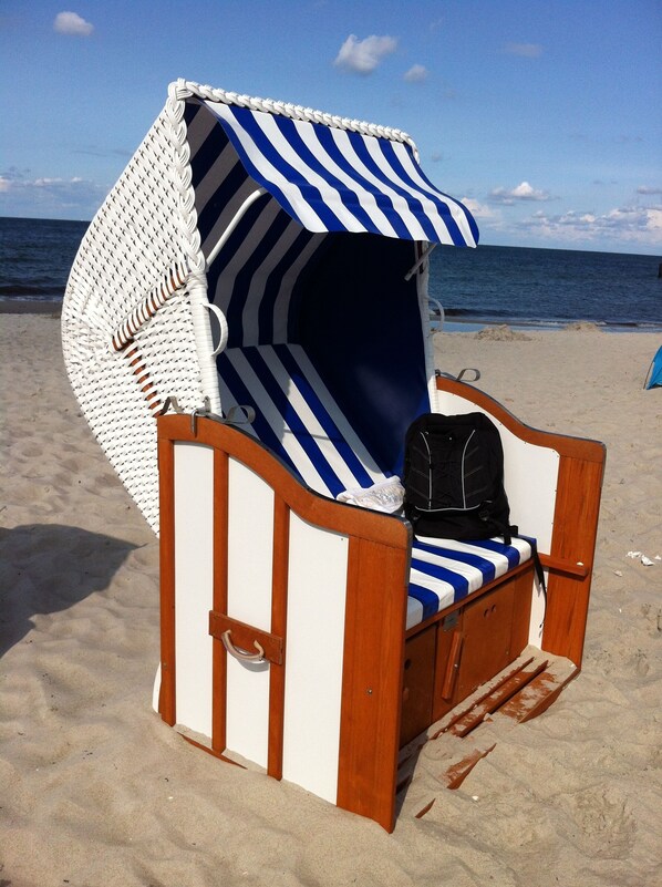 On the beach, sun-loungers