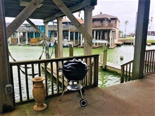 2 Boat Slips with Lifts. 2 Bedroom, 2 Bath. Large Garage.