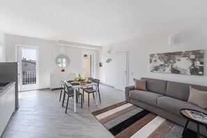 Business Apartment | Living area | 35-inch TV with digital channels