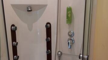 Shower, eco-friendly toiletries, hair dryer, towels