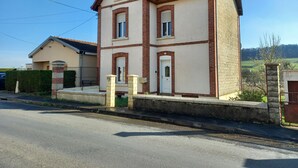 A two-story house with a pitched roof, a front door, and a small porch area. - La Locomotive by la Bb12087 (Nouvion-sur-Meuse)