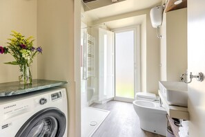 Shower, eco-friendly toiletries, hair dryer, bidet