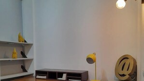 A study area with a desk, shelves, and a lamp. - Central Location -"FRIDA" (Cabo San Lucas)