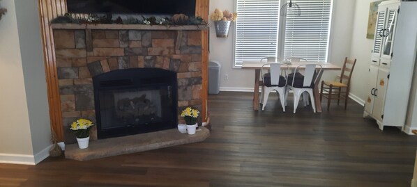 A living room with a stone fireplace, wooden flooring, a dining table with chairs, and a white cabinet. -
Mountain Retreat in Blue Ridge Mountains. Privacy! Owner Managed. (Fleetwood)