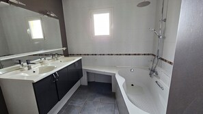 Shower, hair dryer, towels, toilet paper