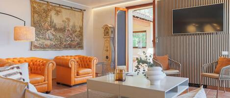 Apartment, Lake View | Living area | 30-inch TV with digital channels