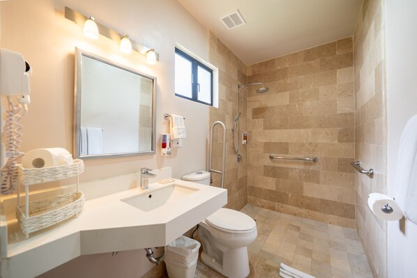 A modern bathroom with a sink, toilet, and shower. - Villas Sol 21 Serenity Place at Playa Hermosa (Playa Hermosa)