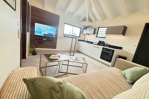 Suite Caribéenne with View #9 | Living area | 55-inch Smart TV with digital channels, MP3 dock