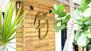 A wooden entrance with a sign reading "Friendly SXM". - The Forest Suites at Anse Marcel | Boutique Hotel & Restaurant (Anse Marcel)