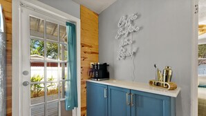 A kitchen with a coffee machine, a barista spoon set, and a neon sign on the wall. - 10 min Lido Key Beach~St. Armand Circle~ Short drive to Siesta Key Beach (Sarasota)