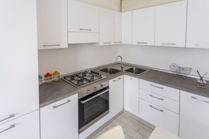 Fridge, stovetop, coffee/tea maker, cookware/dishes/utensils