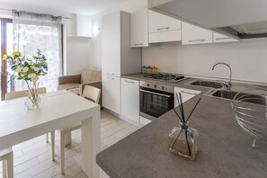 Fridge, stovetop, coffee/tea maker, cookware/dishes/utensils