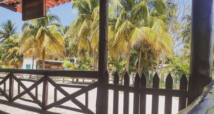 Cozy fully equipped house just one block away from a pristine beach!