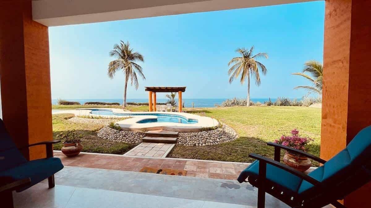 Oceanfront patio with stunning views and a peaceful outdoor setting