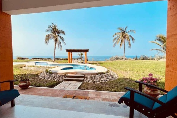 Oceanfront patio with stunning views and a peaceful outdoor setting
