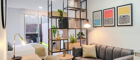 Desk, iron/ironing board, bed sheets