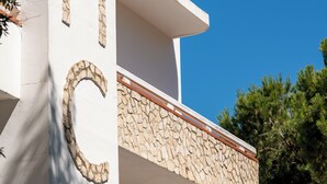 A building with a stone facade and a balcony.