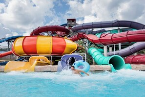 A water park with multiple water slides in various colors.