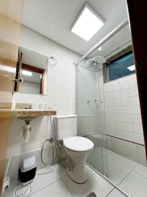 Shower, rainfall showerhead, hair dryer, towels