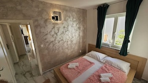Deluxe Apartment, Sea View | 2 bedrooms, iron/ironing board, free WiFi, bed sheets