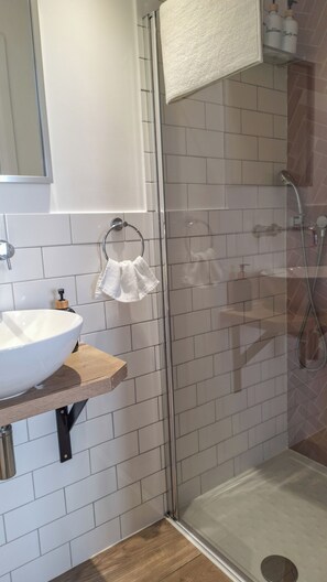 Shower, hair dryer, towels, soap