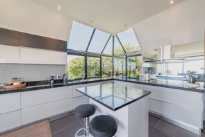 Fridge, coffee/tea maker, cookware/dishes/utensils