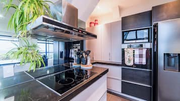 Fridge, coffee/tea maker, cookware/dishes/utensils