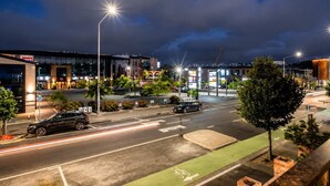 A multi-level parking structure with clear signage and a well-lit entrance. - The City Sanctuary | 4BR | 4 Baths | CBD (Christchurch)