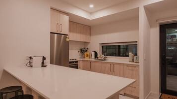 Coffee/tea maker, fridge, microwave, oven
