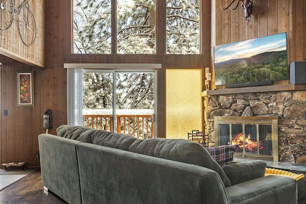 Cozy up by the wood fire, see pines out the big windows, or stream on smart TV