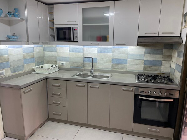 Apartment | Private kitchen | Fridge, microwave, oven, stovetop