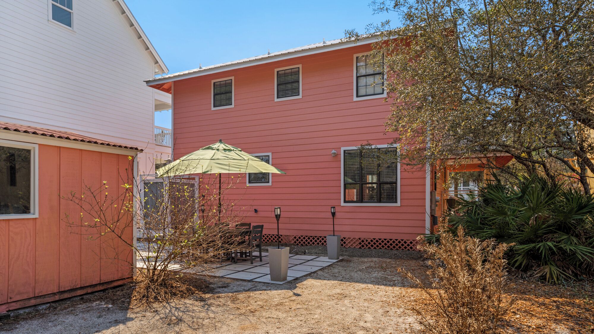 A two-story house with a patio area.