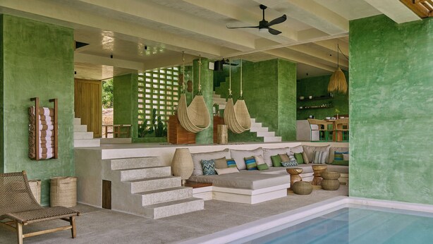 A modern interior with a pool, a staircase, and a seating area with cushions. - Punta Nayaá - Adults Only (Santa Maria Colotepec)