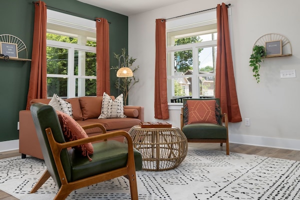 Contemporary living room with sofa bed and window with curtains