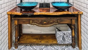 A bathroom with a double sink, a large mirror, and a wooden vanity. - Surf House Cocoa Beach...Family-Friendly, Walk to Beach! (Cocoa Beach)