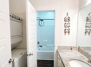 Enjoy a refreshing shower in the walk-in shower with a handheld showerhead and control panel.