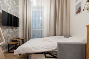 1 dormitorio, tabla de planchar con plancha, wifi y ropa de cama