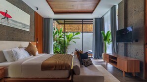 A modern bedroom with a large bed, a TV, and a view of a garden.